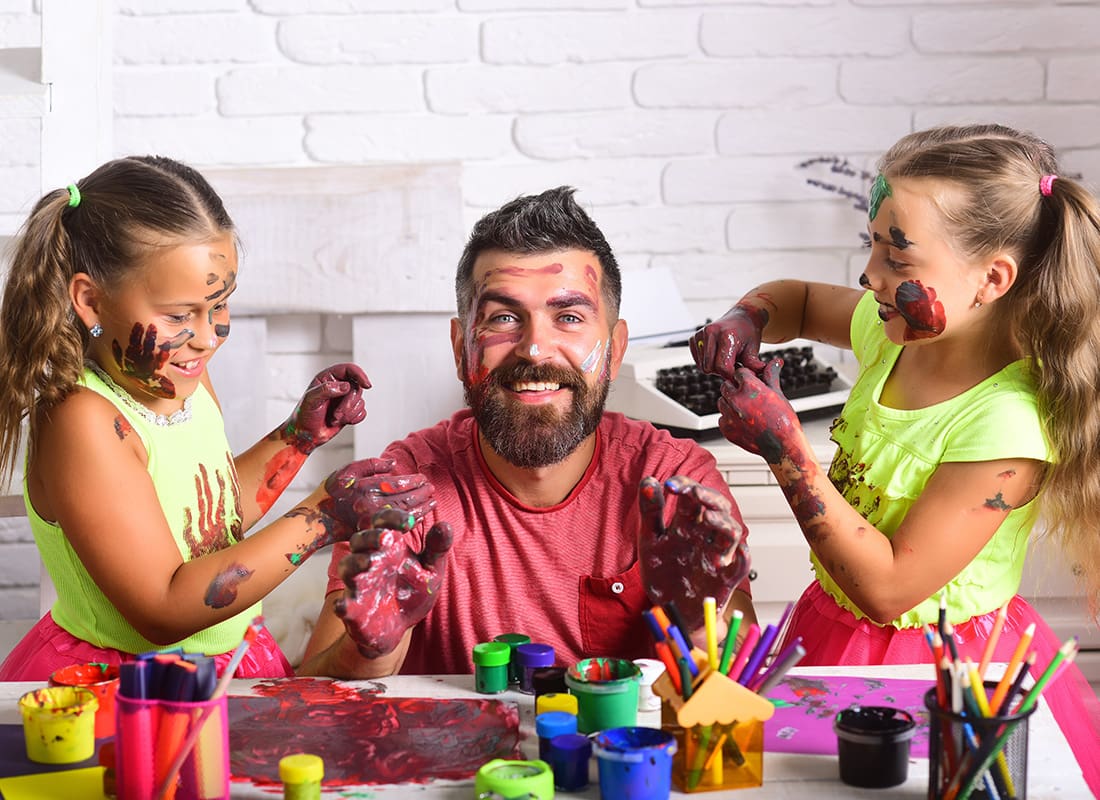 Personal Insurance - Father and His Daughters Play With Paint